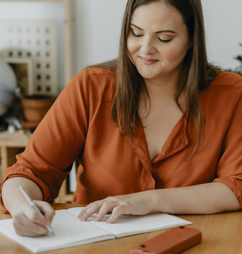 Woman writing to do list